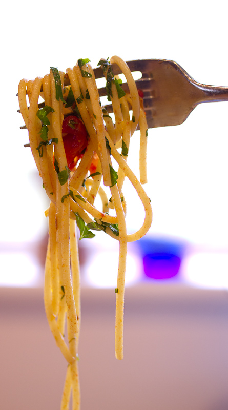 Pasta with grape tomatoes, colatura and garlic