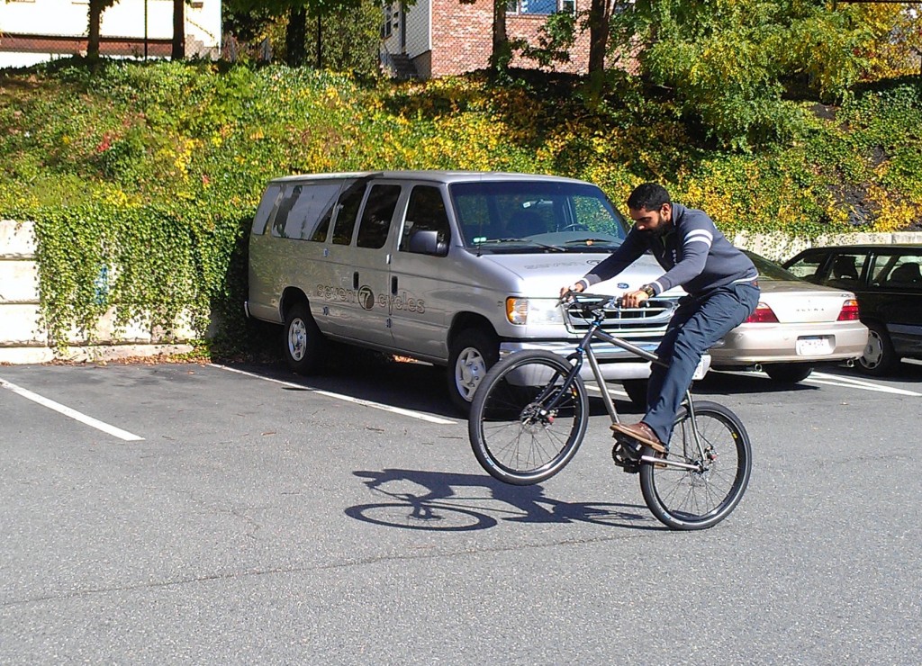 Neil pops a wheelie in the Seven parking lot