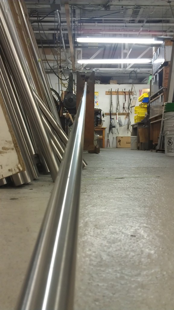 A very long titanium tube poised to go into the lathe