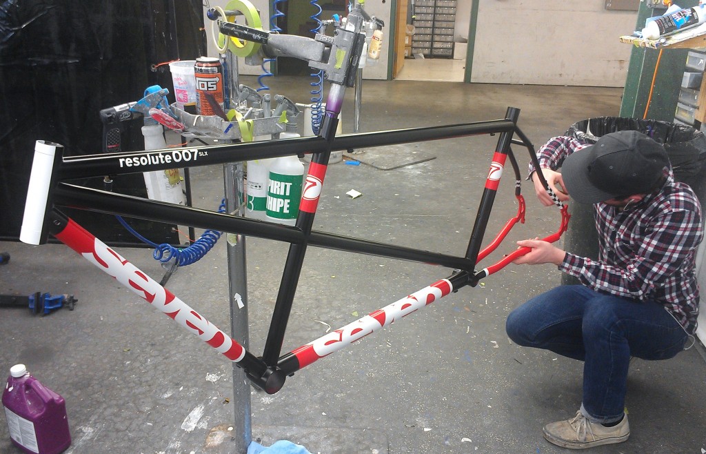 Putting the final touches on a beautifully painted Seven steel tandem