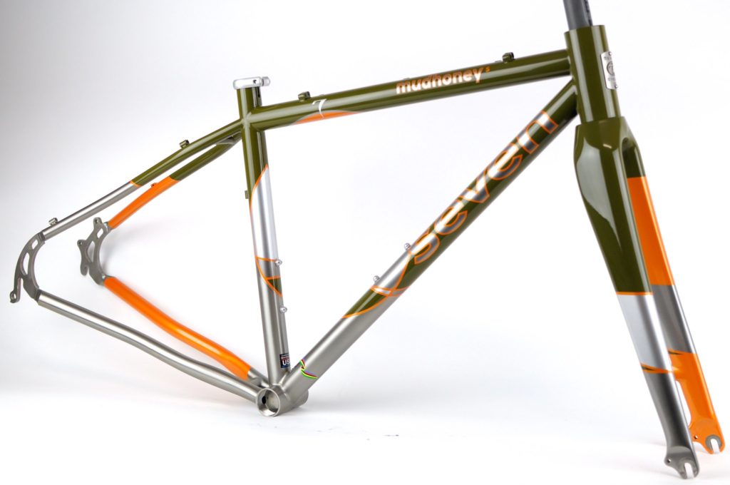 a Modhoney S frame, beautifully painted in rich green and bright orange with silver accents