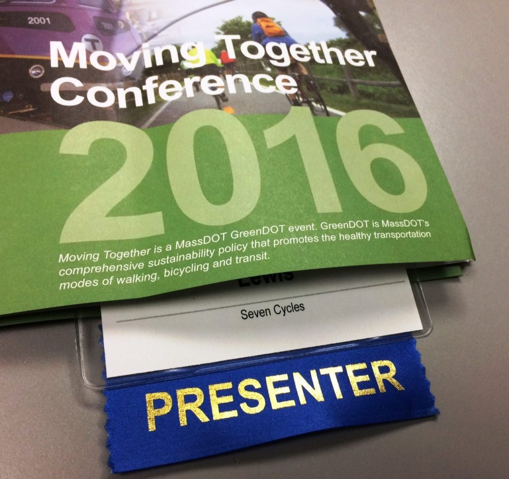 Moving Together Conference 2016 Pamphlet with 'Seven Cycles - Presenter' badge poking out
