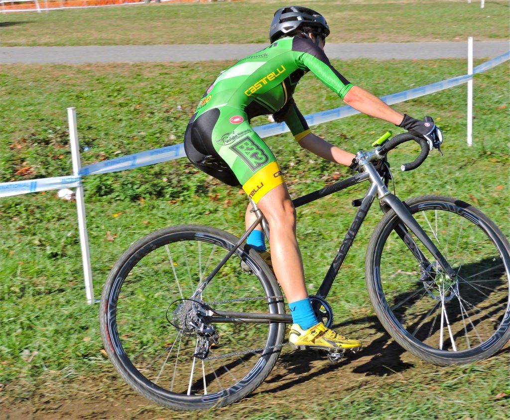 Jule Wright races on a grassy cyclocross course at Nationals