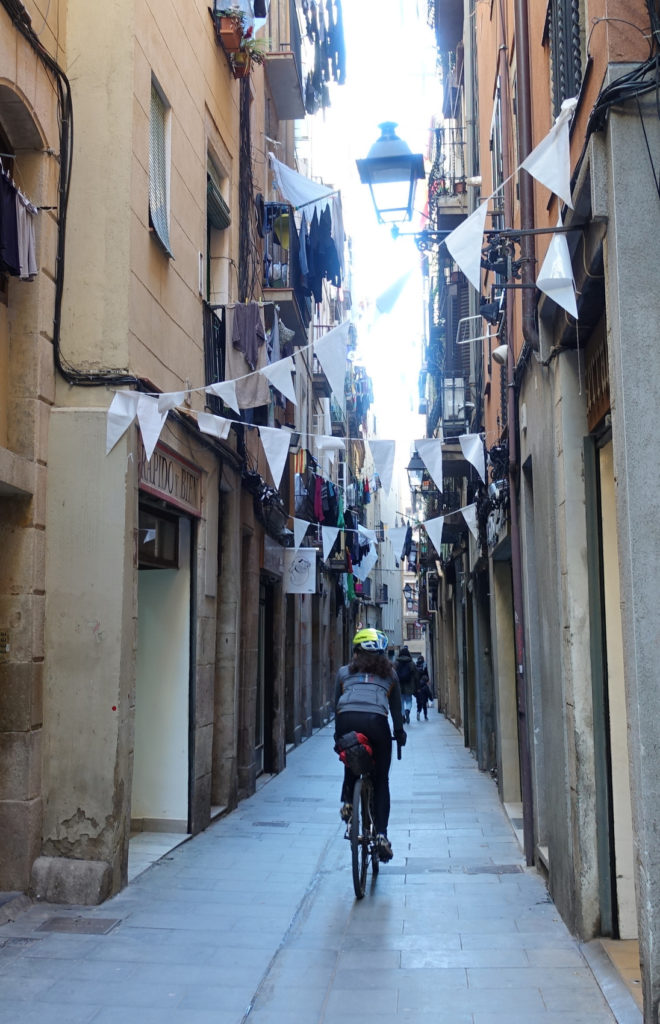 Riding up a narrow street in Barcelona