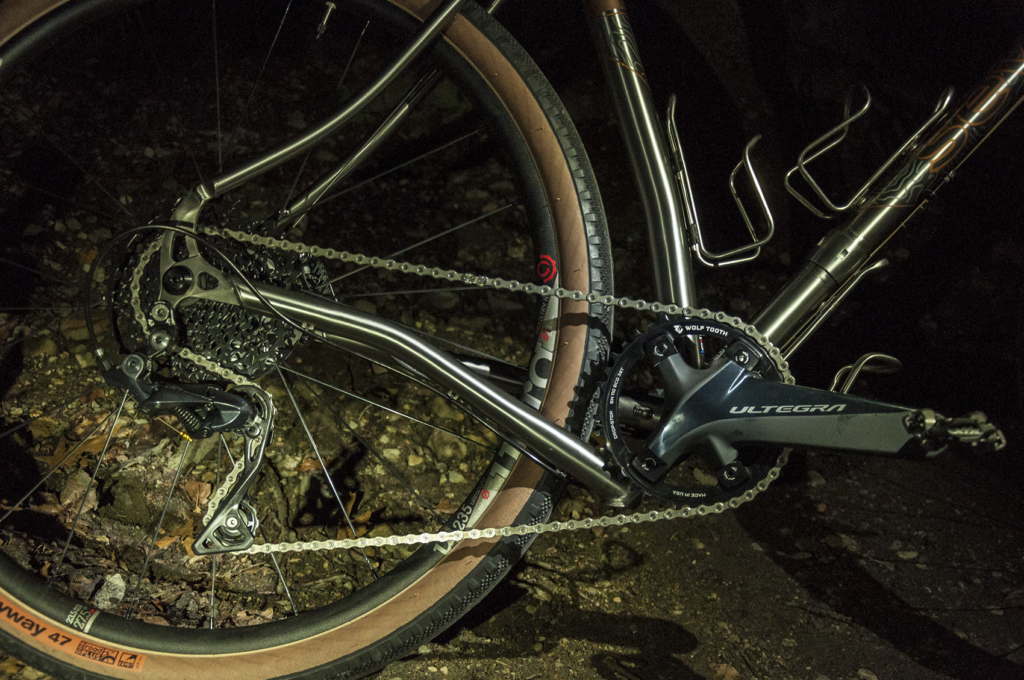 night shot of a bike's drive train with a dropped chainstay