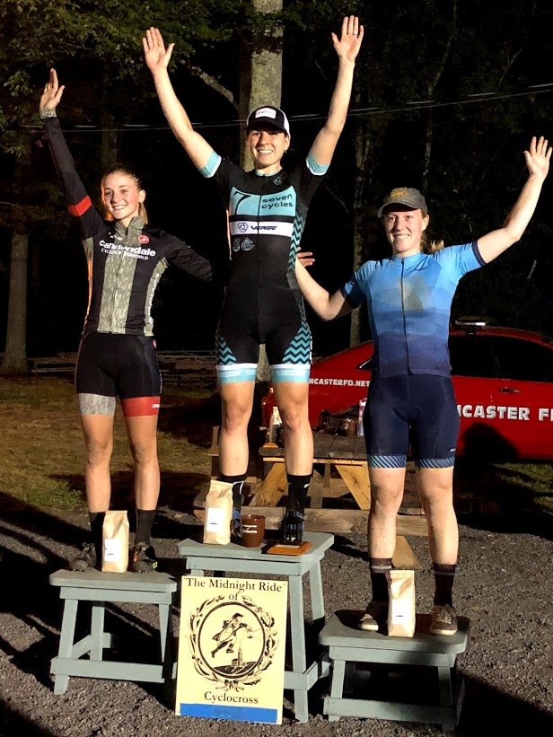 Kelly Catale on the top podium at the Midnight Ride of Cyclocross