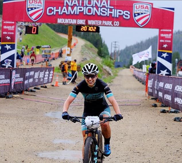 Kelly Catale crosses the finish like at the National Championships