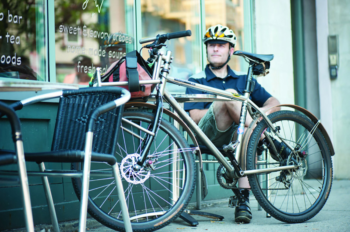 bicycle commuter outside a cafe