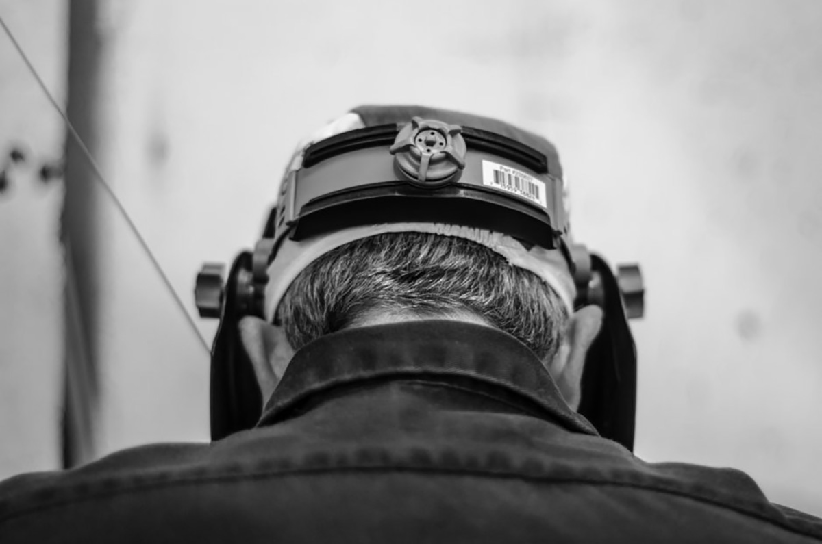 the back of the head of a master TIG welder