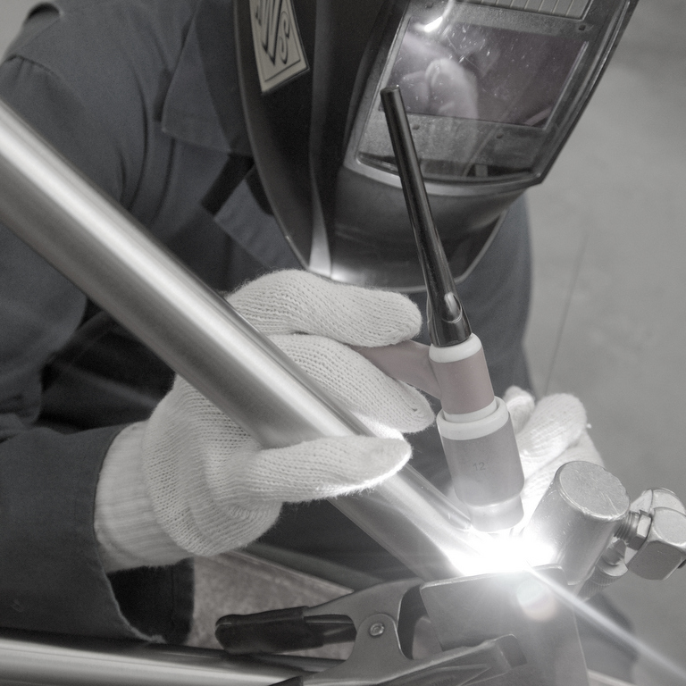 your custom bicycle frame under the TIG welding torch