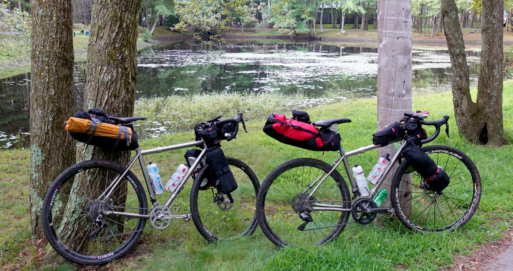 gravel bikepacking by a pond's edge
